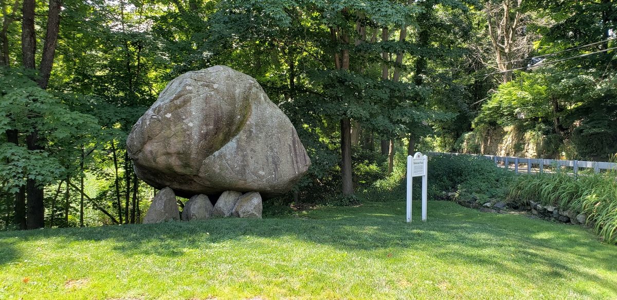 large rock balanced on other rocks